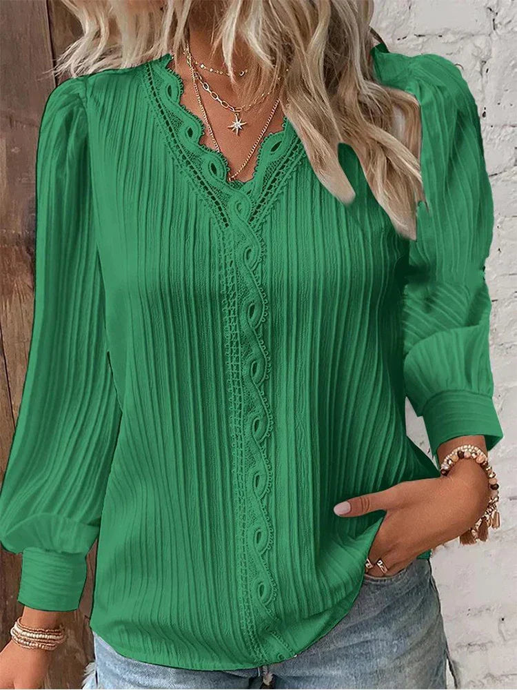 Casual women's white lace accent blouse with puff sleeves, styled for a relaxed yet elegant summer look.