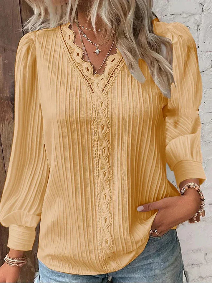 Versatile women's elegant white lace accent blouse with puff sleeves, suitable for casual to sophisticated style.