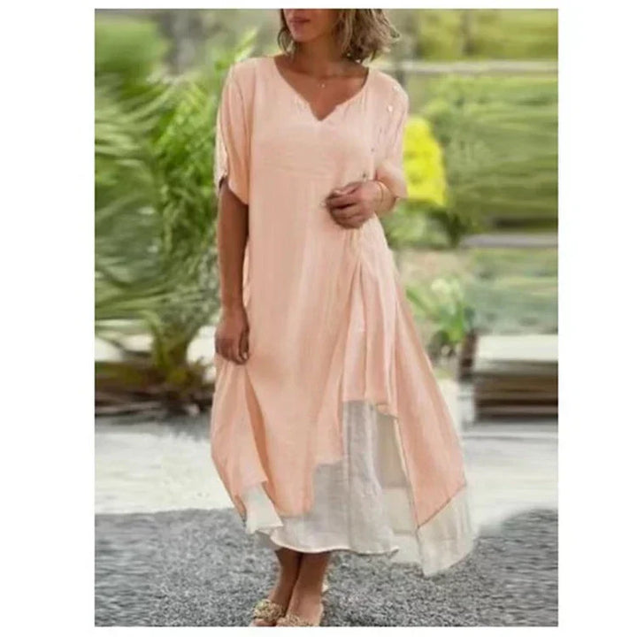 Chic women's layered V-neck short sleeve midi dress. Offers a relaxed, elegant look for summer style.