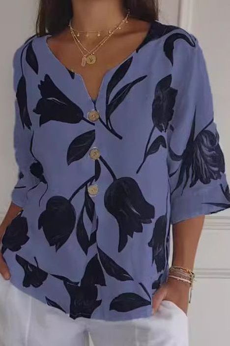 Polished women's long sleeve blouse, an elegant and modern top for sophisticated office looks or smart casual style.