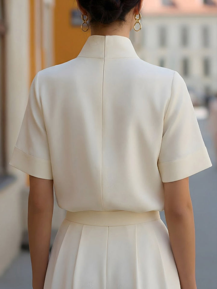 Short sleeve women's top: elegant mandarin collar, relaxed fit. Ideal for office fashion.