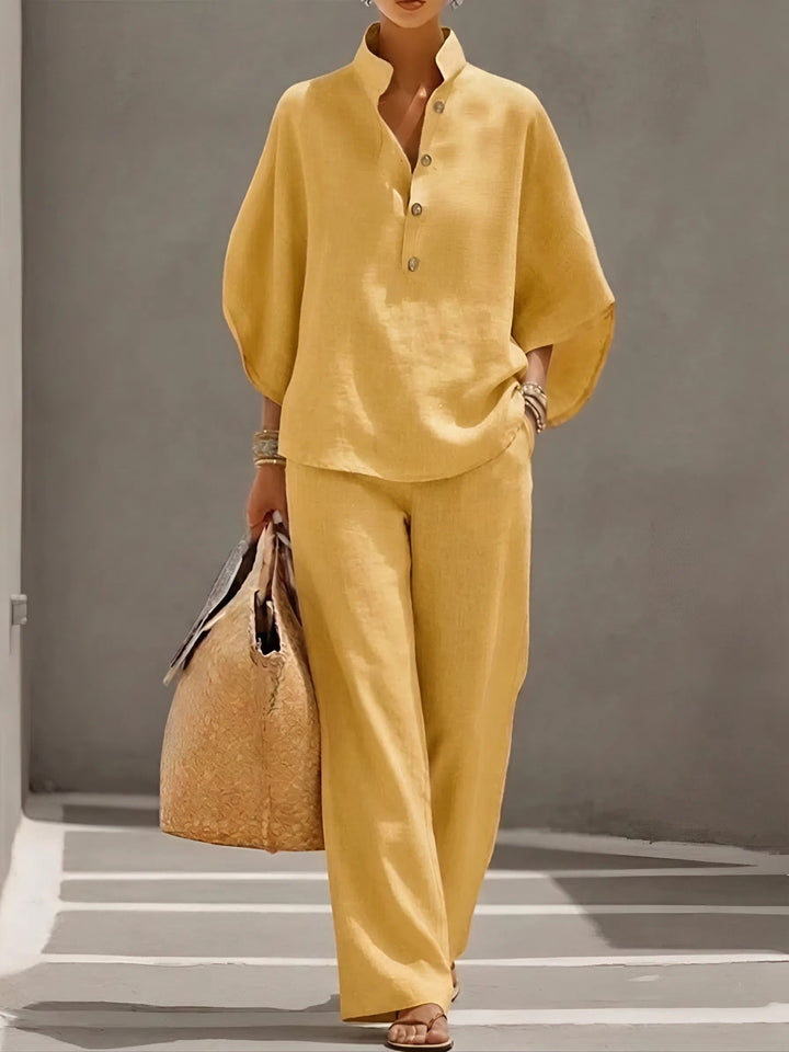 Fashionable women's summer outfit: a mandarin collar top paired with flowy wide-leg pants.