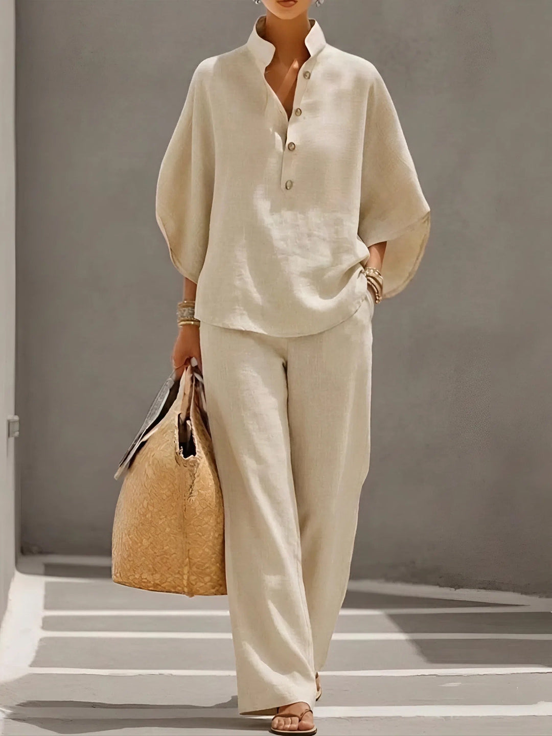 Coordinated women's set for summer, featuring a mandarin collar top and stylish wide-leg pants.