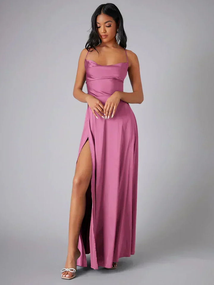 Women's draped neckline maxi evening dress with an alluring open back and sexy high slit for formal events.