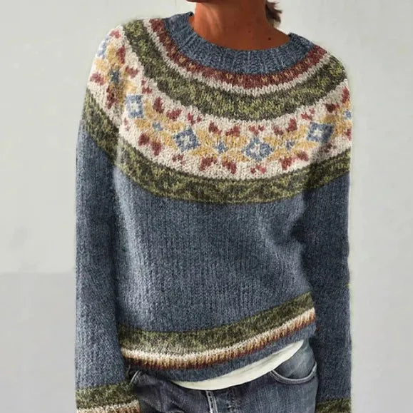 Elegant knit women's sweater with a vibrant multicolor Nordic pattern, ideal for cozy winter layering.