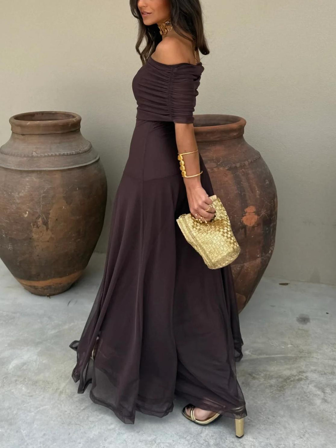 Elegant brown off-shoulder long dress, a stylish choice for formal events and evening wear.