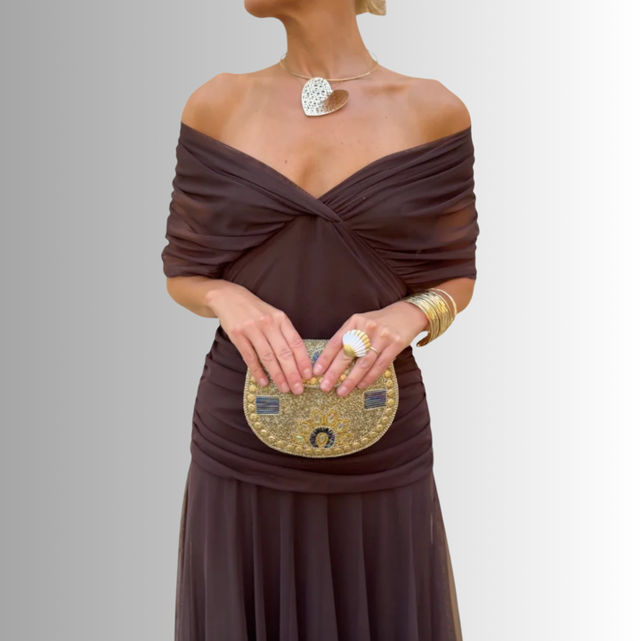 Women's elegant off-shoulder evening maxi dress, flowing & chic, perfect for formal occasions.