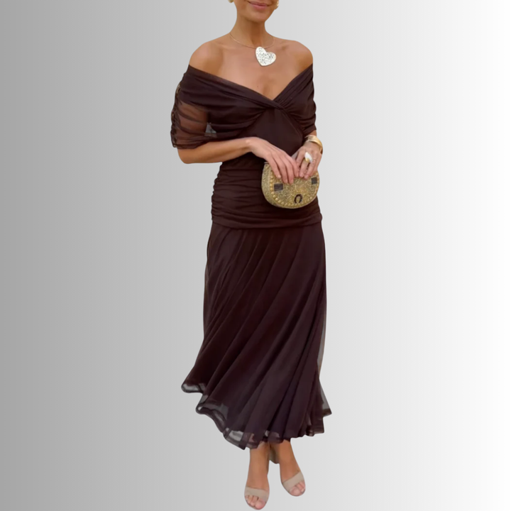 Women's elegant off-shoulder maxi dress, a flowing evening gown suitable for wedding guests.