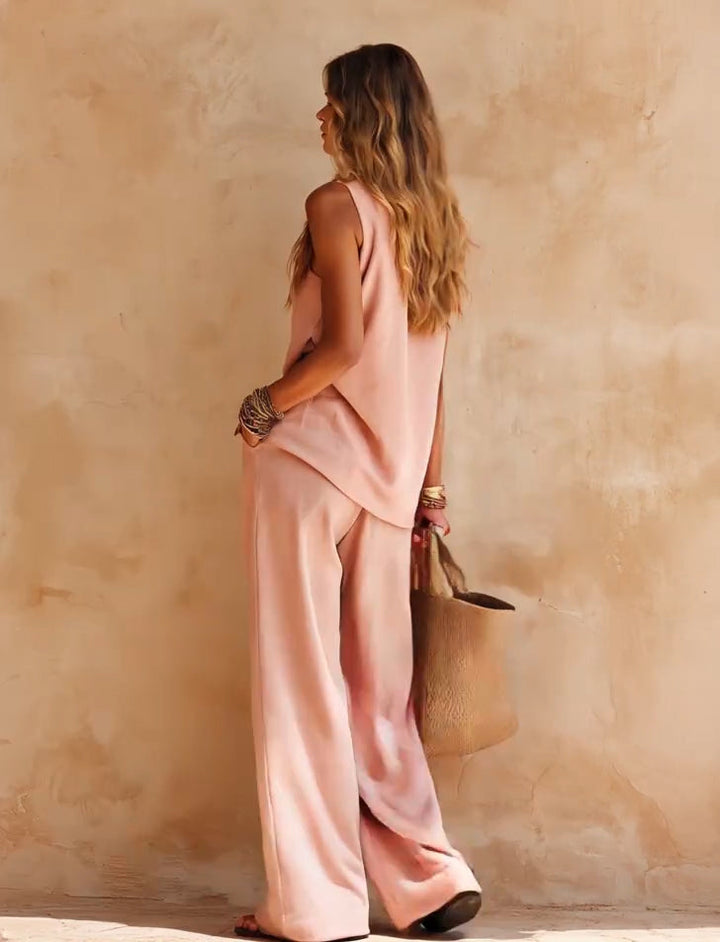 Chic women's one-shoulder jumpsuit with a flowing wide leg & draped silhouette, ideal for summer vacation.