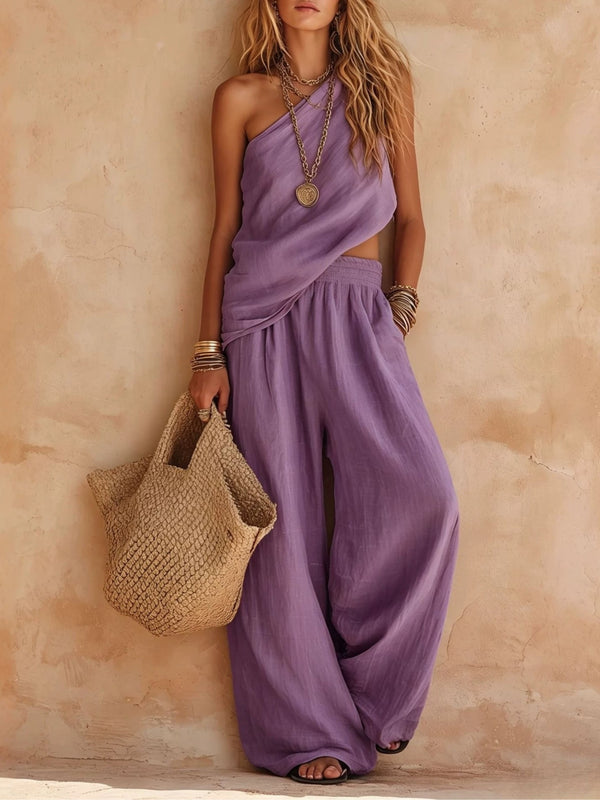 Summer-ready women's draped one-shoulder wide-leg jumpsuit, a stylish and comfortable party outfit.