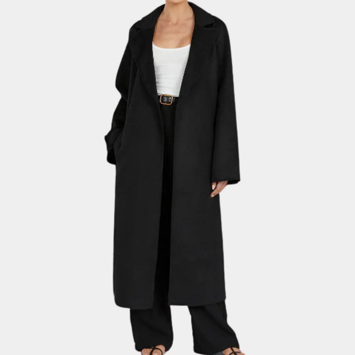 Woman wearing a stylish oversized trench coat with belt, ideal for elegant fall fashion & versatile outerwear.