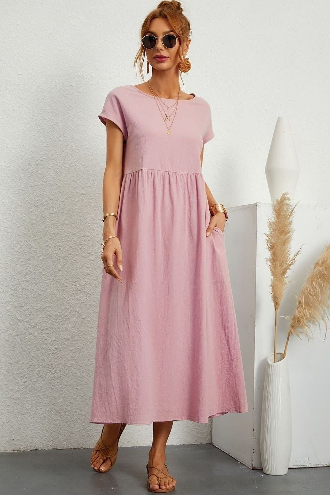Comfortable women's elegant midi dress with beautiful pleats. Versatile for any season, especially spring.