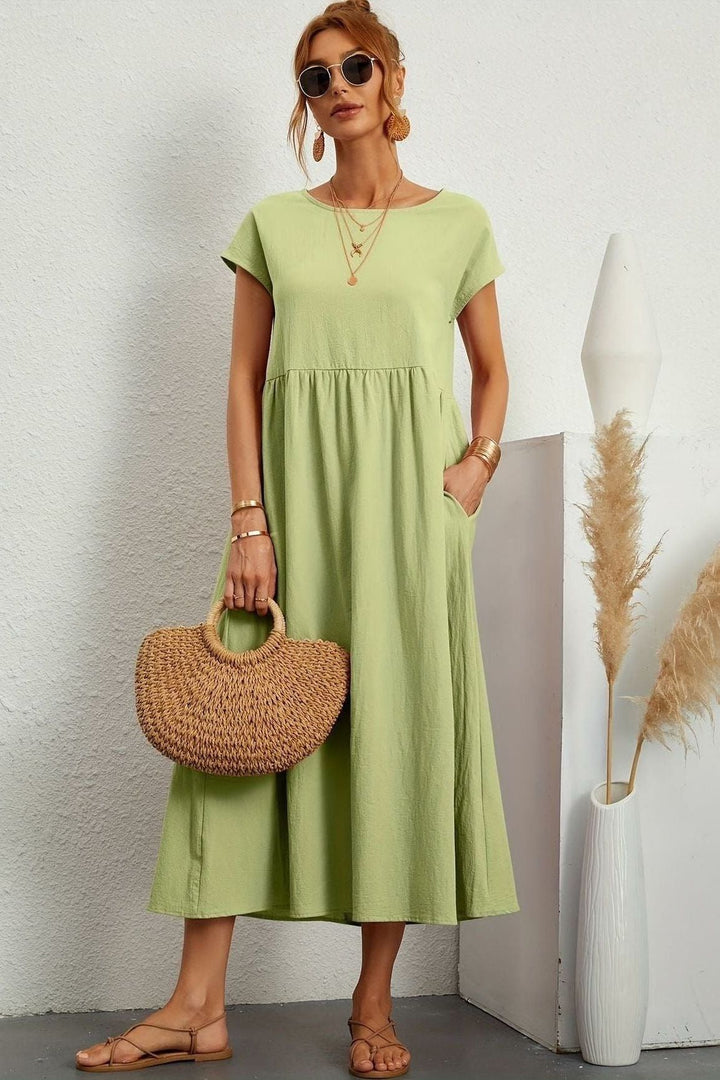 Stylish women's midi dress, elegantly pleated for versatile & comfortable wear. Perfect summer dress.