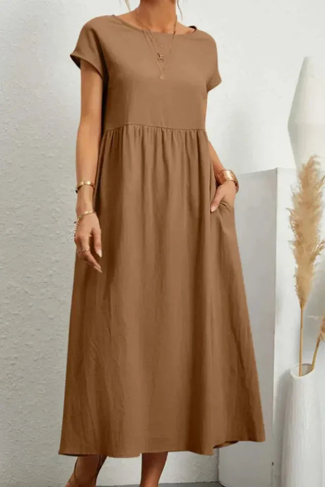 Comfortable women's elegant midi dress with beautiful pleats. Versatile for any season, especially spring.