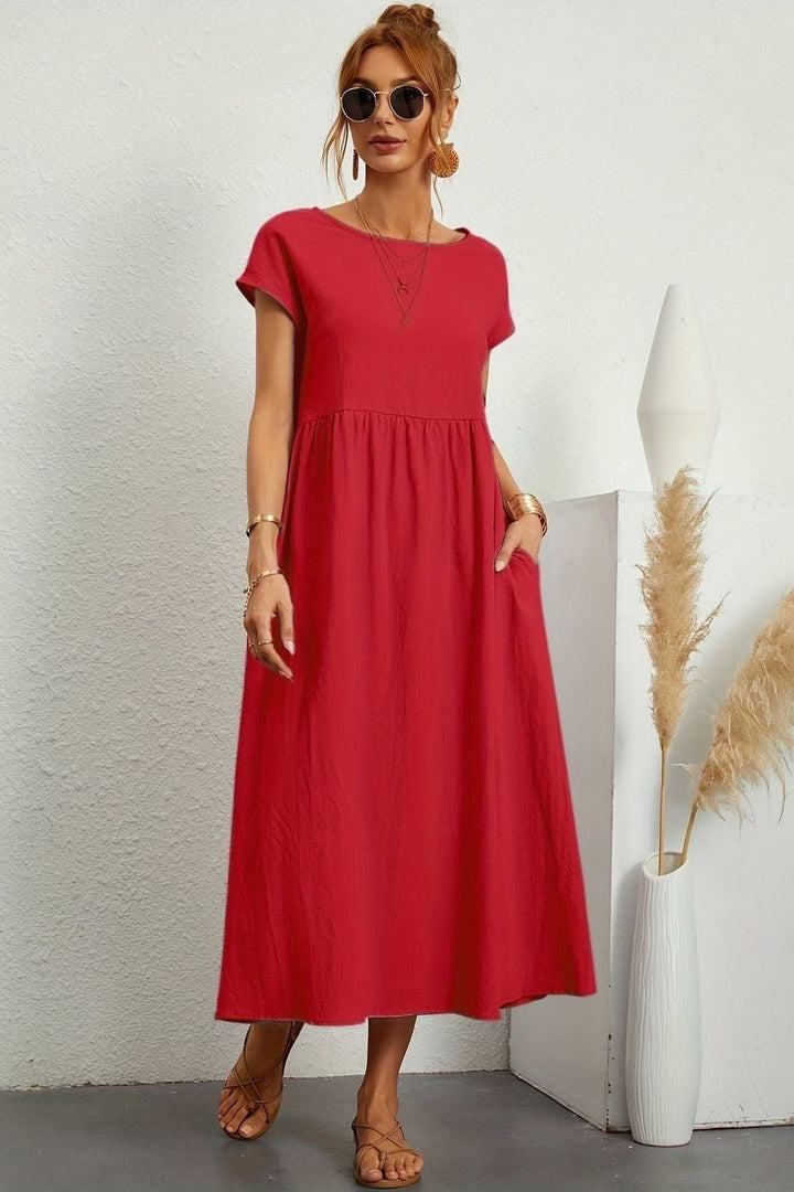 Comfortable women's elegant midi dress featuring beautiful pleats. Perfect versatile summer dress.