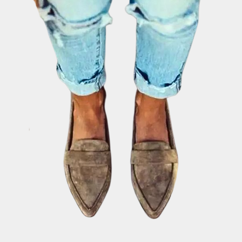 Modern women's pointed-toe slip-on loafers, chic, versatile, and elegant for professional outfits.