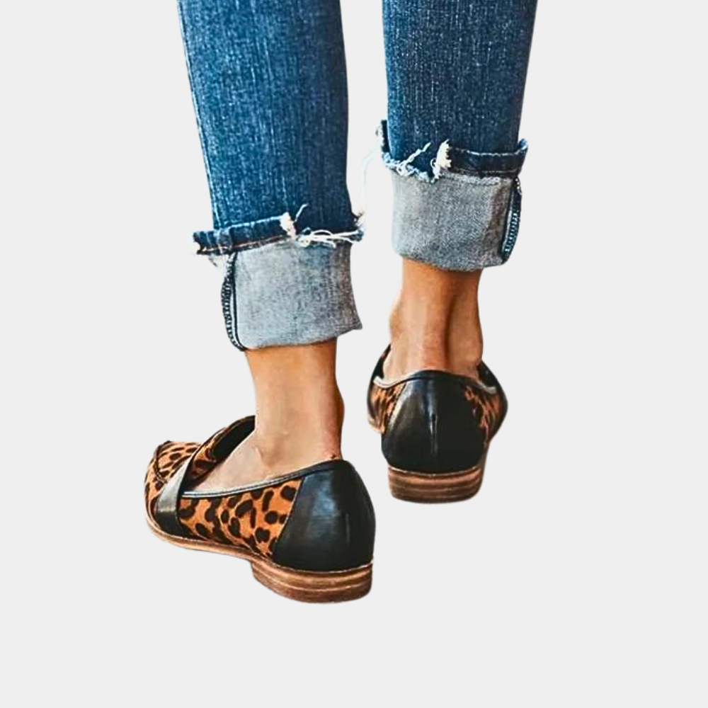 Sophisticated women's pointed-toe slip-on footwear, combining comfort with professional & casual style.