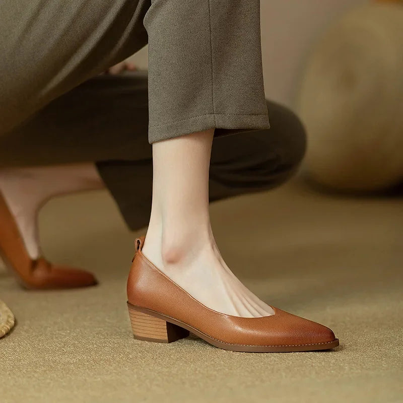 Side view: Women's beige pointed toe slip-on court shoes with a comfortable mid block heel.
