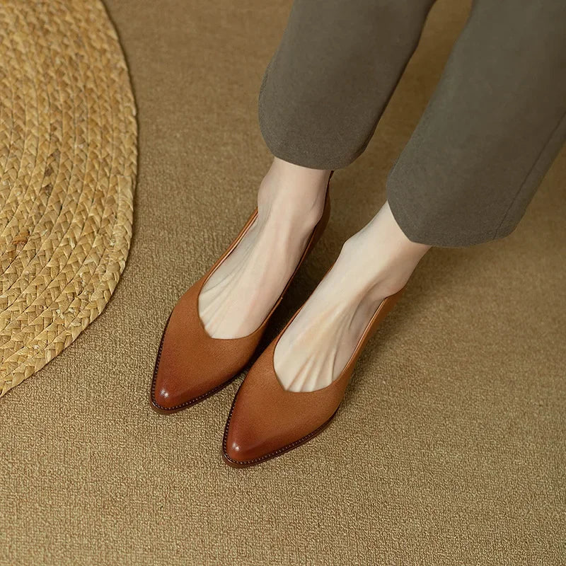 Front view: Women's brown elegant slip-on court shoes. Stylish pointed toe & mid block heel.