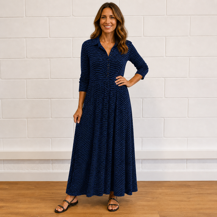 Chic women's printed long sleeve button-front maxi dress. Flowy design with elegant print, ideal for vacation or casual wear.