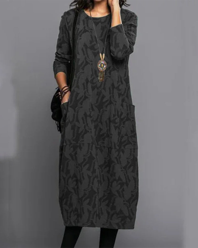 Sophisticated women's printed long-sleeve midi dress, showcasing a beautiful pattern and elegant drape.