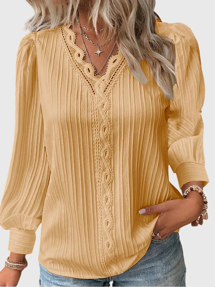 Women's elegant pullover blouse. Chic long sleeve top for versatile wear, perfect for office or casual sophistication.