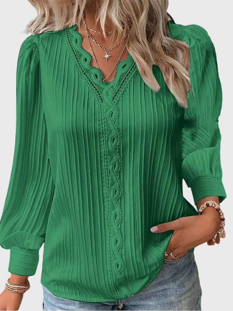 Comfortable women's chic pullover blouse. Versatile long sleeve top for everyday elegance and stylish wear.