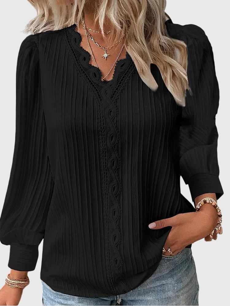 Dressy women's pullover blouse. Sophisticated long sleeve top, ideal for office wear or elegant casual outfits.