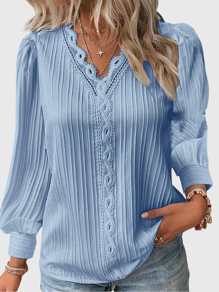 Women's long sleeve pullover blouse in a chic, elegant style. Versatile top for dressy or casual fashion.