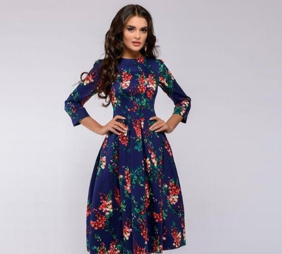 Women's vintage fashion floral print midi dress. Elegant A-line silhouette with chic 3/4 puffed sleeves.