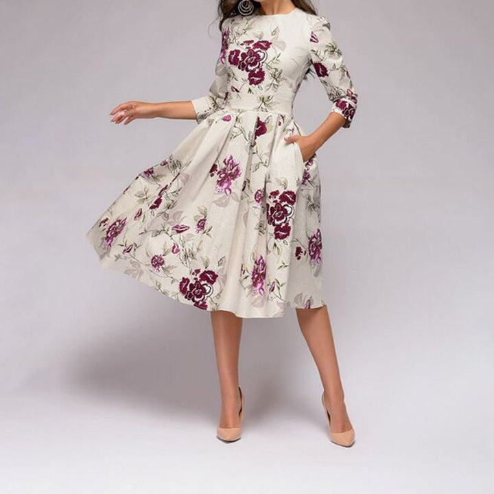 Bestselling women's retro style A-line midi dress. Features elegant 3/4 sleeves and a charming floral print.