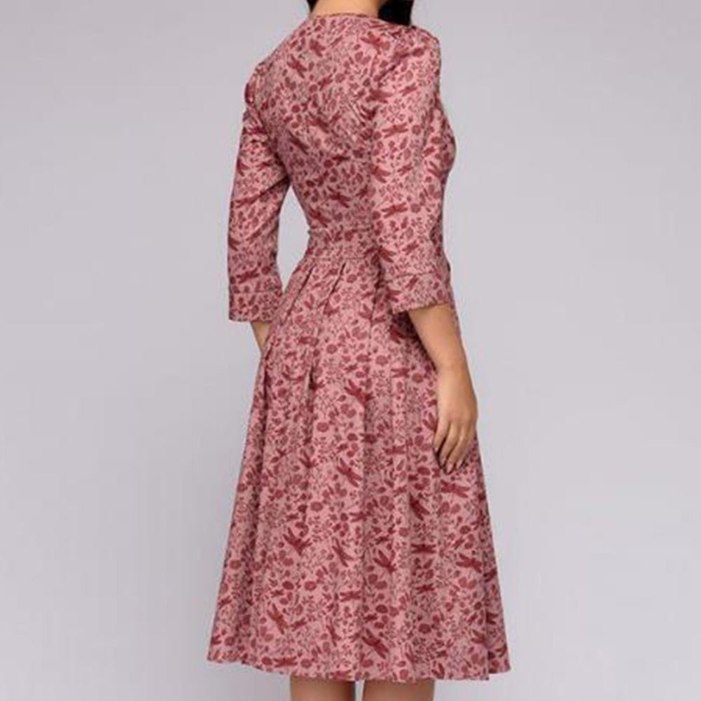 Vintage fashion women's A-line dress with 3/4 puffed sleeves. Elegant midi length, great for casual or event.