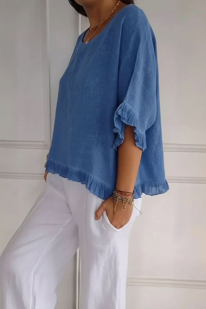 Stylish women's ruffle blouse featuring delicate ruffles. An effortless casual blouse & elegant office top.