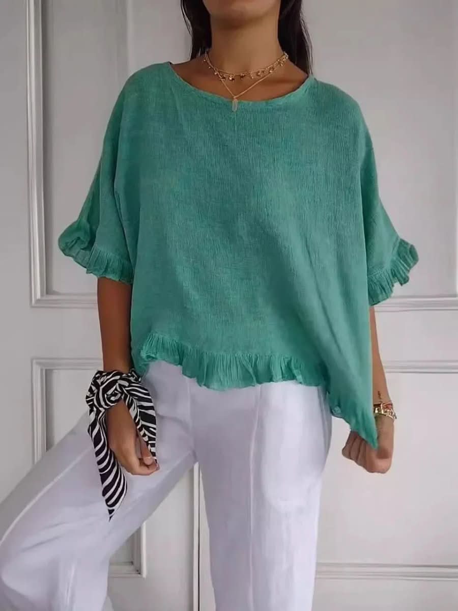 Fashionable women's ruffle blouse. This versatile top offers effortless style for both casual and elegant wear.