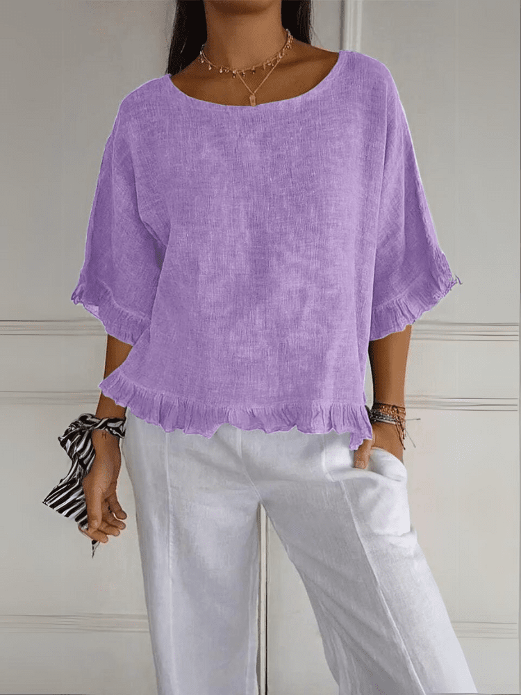 Versatile women's ruffle blouse, effortlessly blending elegance with casual comfort. A must-have summer top.