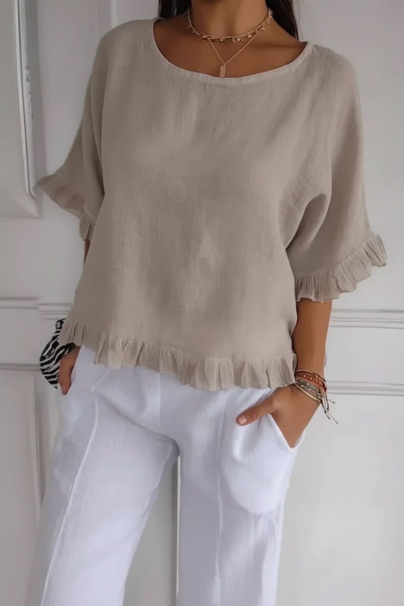 Elegant women's ruffle blouse, embodying chic style. A fashionable and versatile top for various occasions.