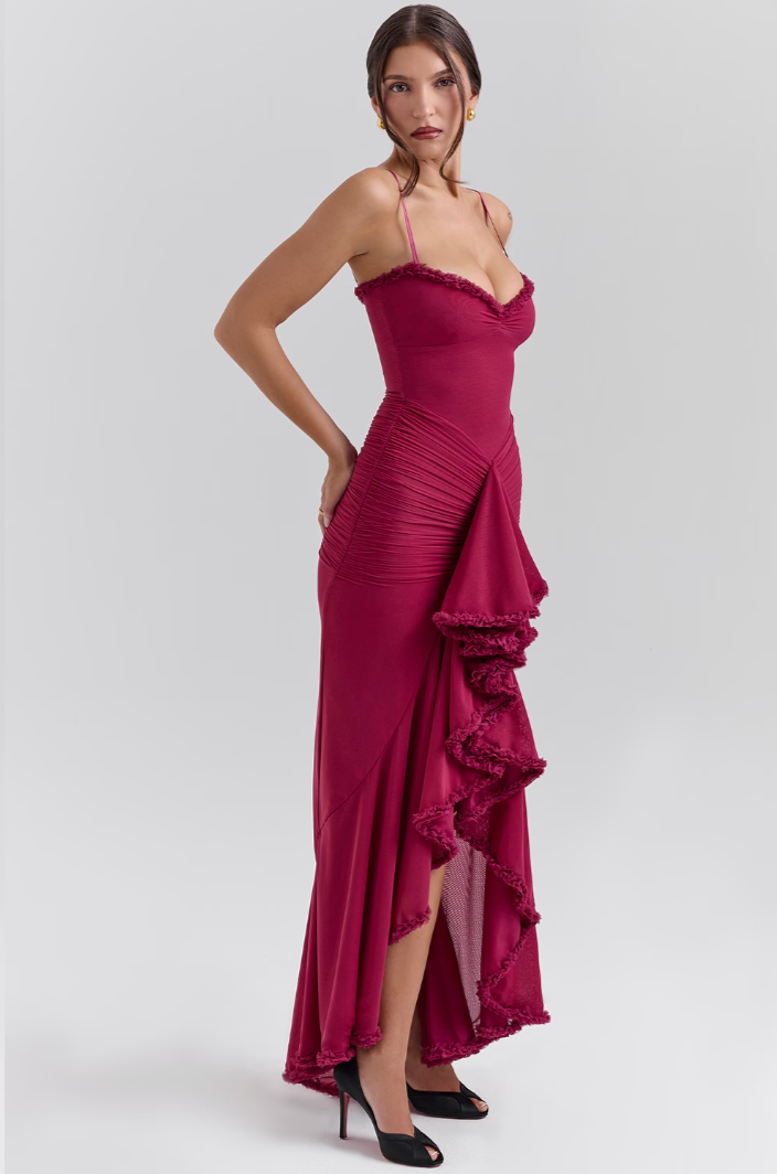 Beautiful sleeveless maxi dress, perfect for wedding guests. Features a chic ruffle design & flowy hem.