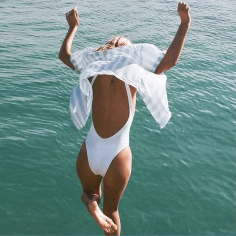 Stylish women's one piece swimsuit featuring a sophisticated scoop neck and alluring open back design.