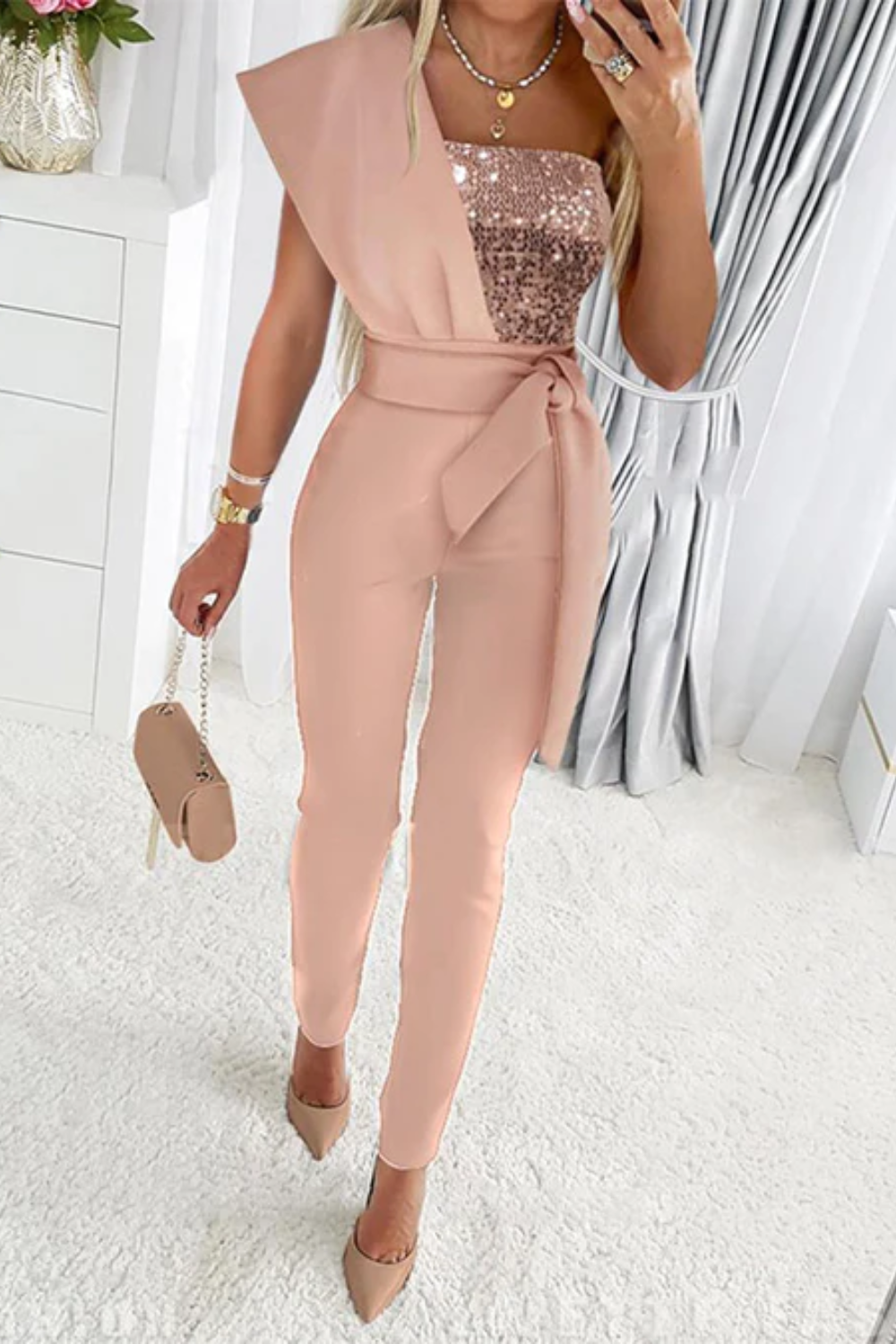 Sparkling sequin detailing on a women's formal jumpsuit, ideal for glamorous evening wear.