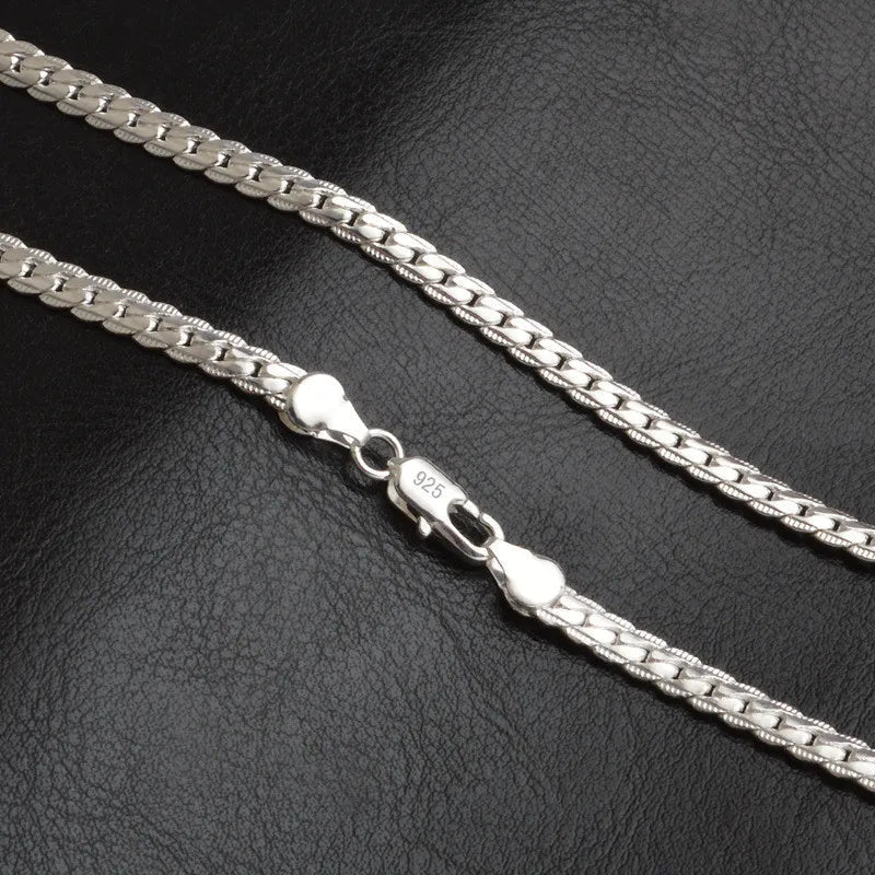 Close-up of a delicate women's silver lucky charm necklace, perfect for elegant fashion jewelry and everyday wear.