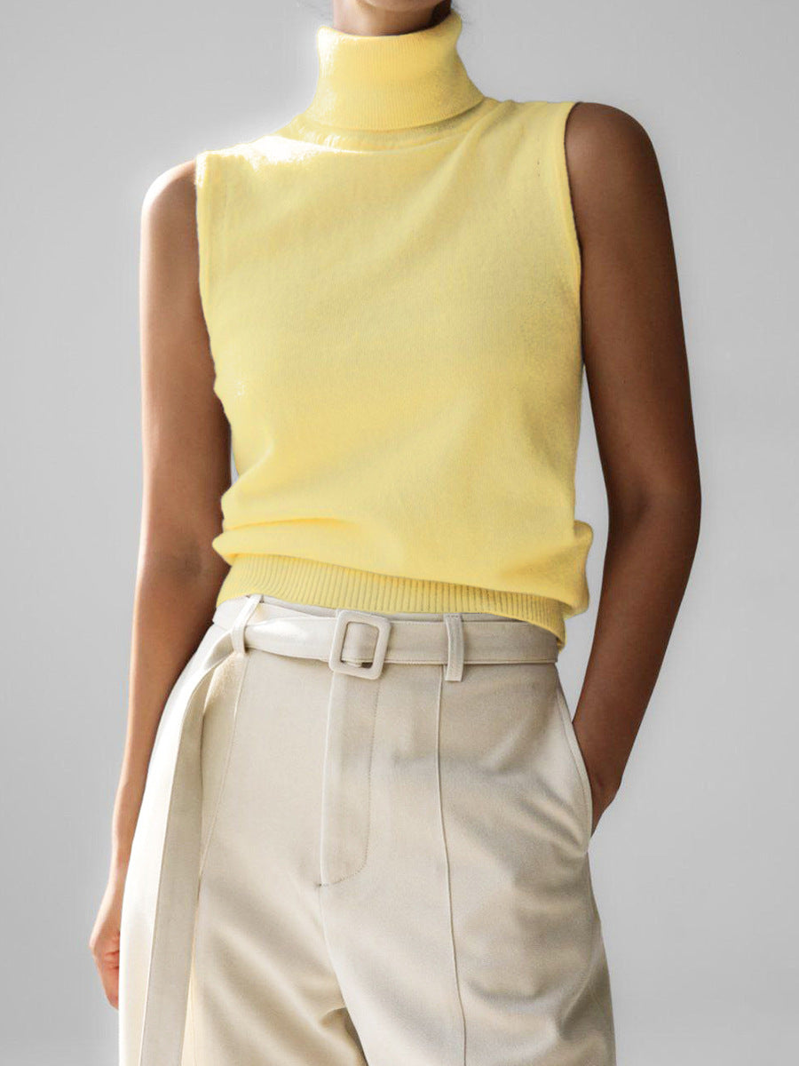 Women's sleeveless mock neck knit top, offering a sleek slim fit for elegant layering options.
