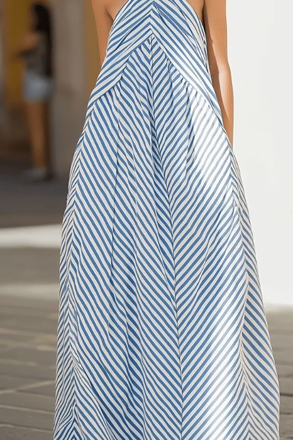 Sleeveless women's maxi dress with striped pattern & chic halter neck, great for elegant summer events & vacation style.