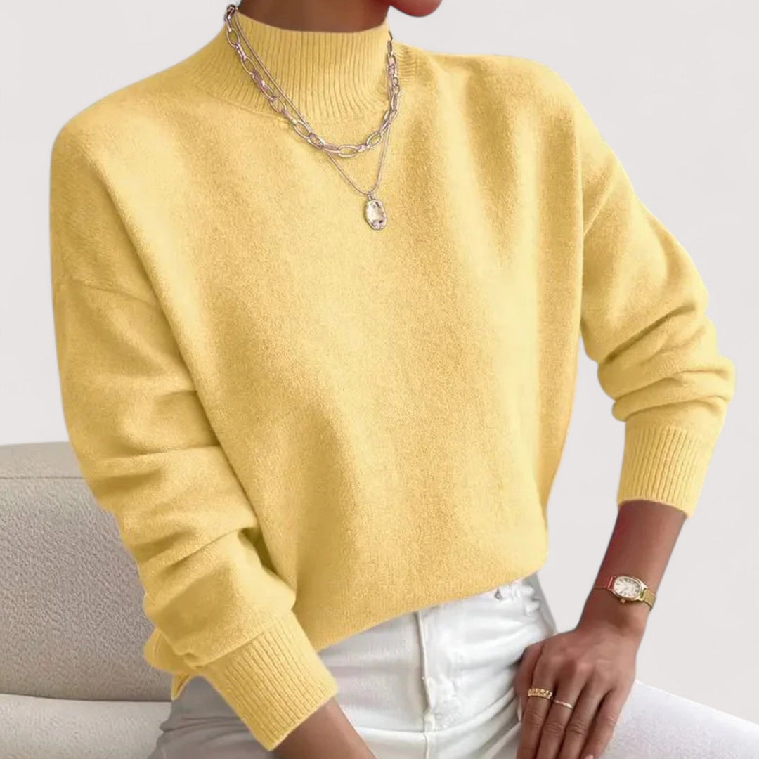 Classic women's elegant turtleneck sweater. Soft knitwear for everyday winter style and comfort.