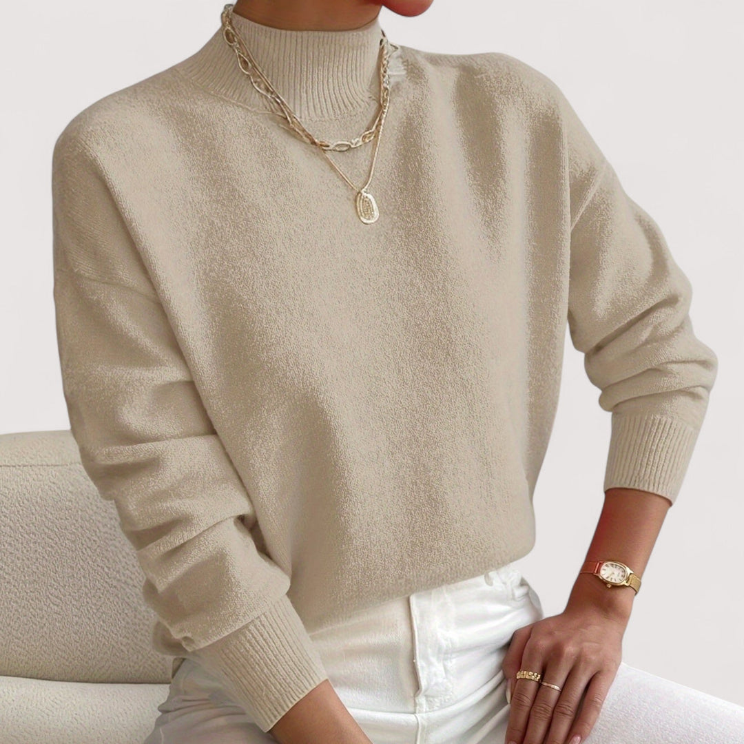 Warm women's long-sleeve turtleneck sweater. Stylish knit pullover for chic winter fashion.