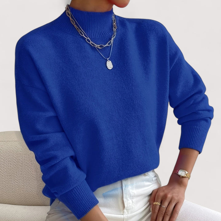Everyday women's elegant turtleneck sweater. Cozy knit pullover, perfect for stylish winter comfort.