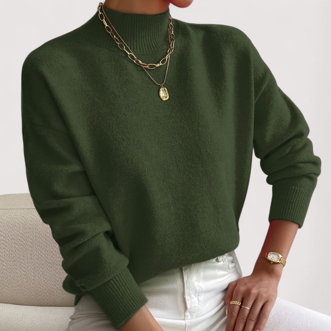 Soft women's long-sleeve turtleneck sweater. Classic knitwear offering warmth and elegance for winter.