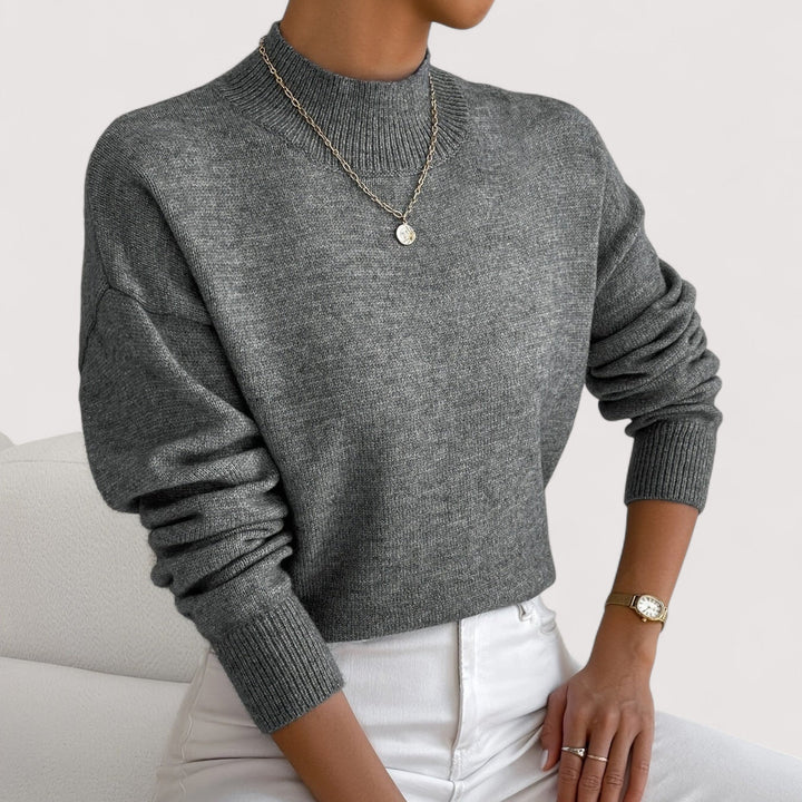 Women's elegant turtleneck pullover. Cozy winter fashion knit sweater, a versatile long-sleeve staple.