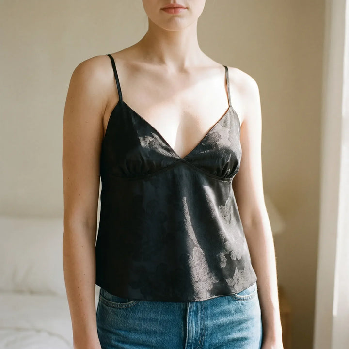 Women's elegant V-neck cami top with delicate floral jacquard and spaghetti straps, perfect for summer.