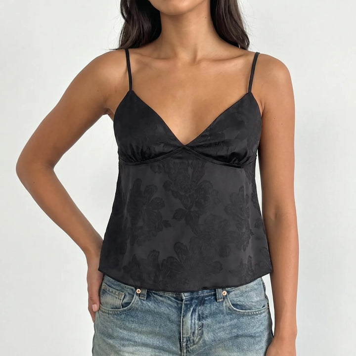 Stylish V-neck floral jacquard cami for women. Elegant spaghetti strap top, versatile for day or evening wear.