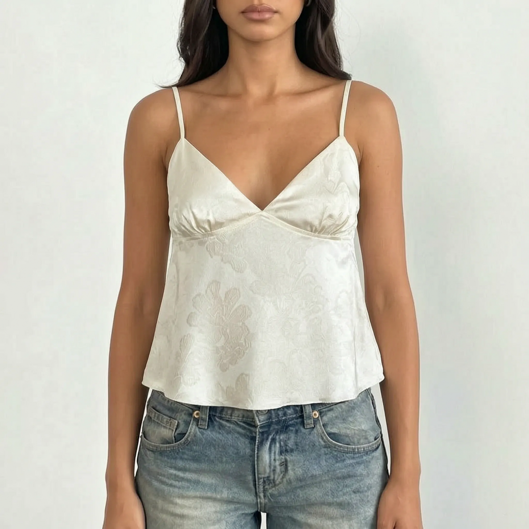Fashionable V-neck cami top for women, showcasing an exquisite floral jacquard pattern and slender straps.